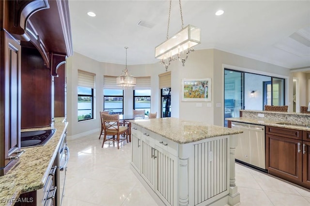 kitchen with stainless steel dishwasher, light tile patterned floors, a kitchen island, a sink, and recessed lighting