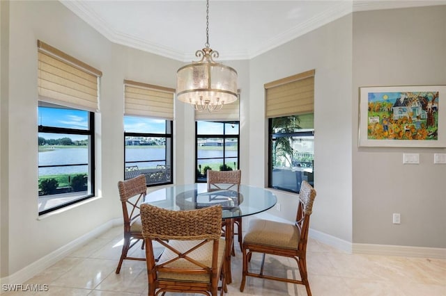 dining space featuring a chandelier, light tile patterned floors, crown molding, and baseboards