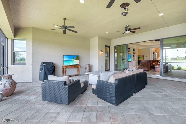 view of patio / terrace with a ceiling fan and outdoor lounge area