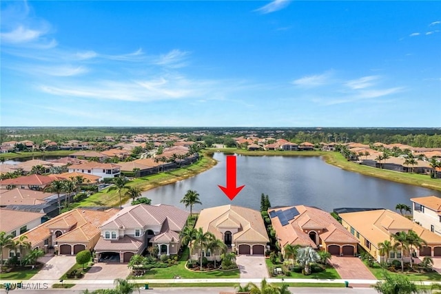 aerial view of residential area with a large body of water