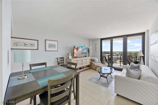 180 Seaview Ct Unit 814, Marco Island, FL 34145 - dining room featuring light tile patterned floors and a textured ceiling