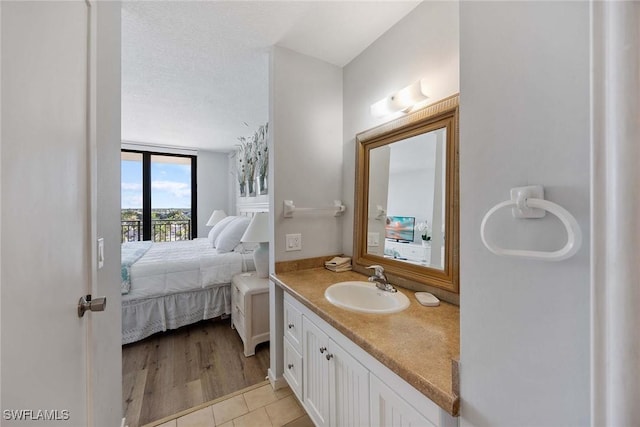 180 Seaview Ct Unit 814, Marco Island, FL 34145 - ensuite bathroom with vanity, connected bathroom, and tile patterned flooring