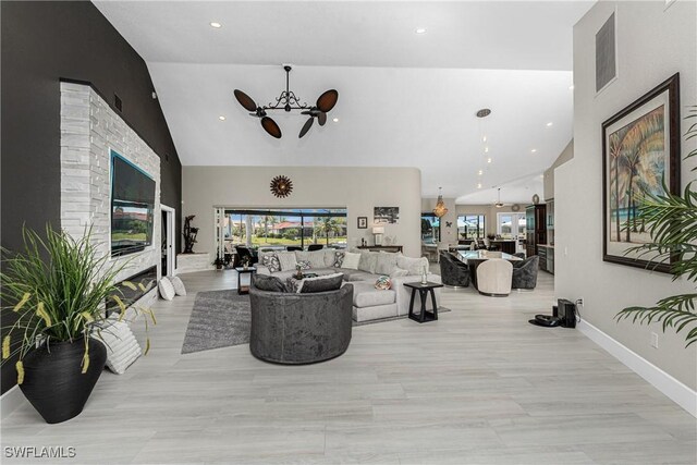 1255 Eider Ct, Punta Gorda, FL 33950 - living area with a chandelier, high vaulted ceiling, recessed lighting, and baseboards