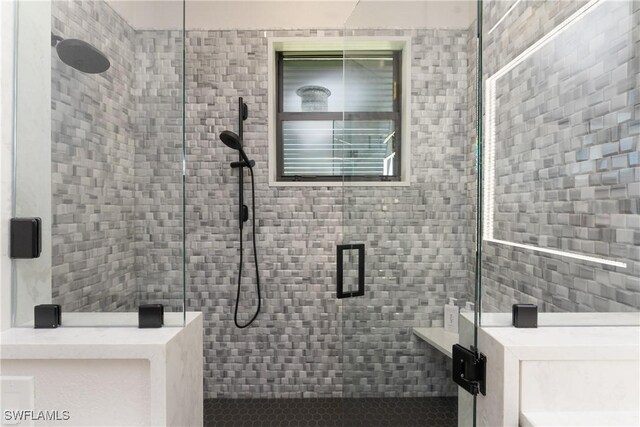 1255 Eider Ct, Punta Gorda, FL 33950 - bathroom featuring tile walls and a stall shower
