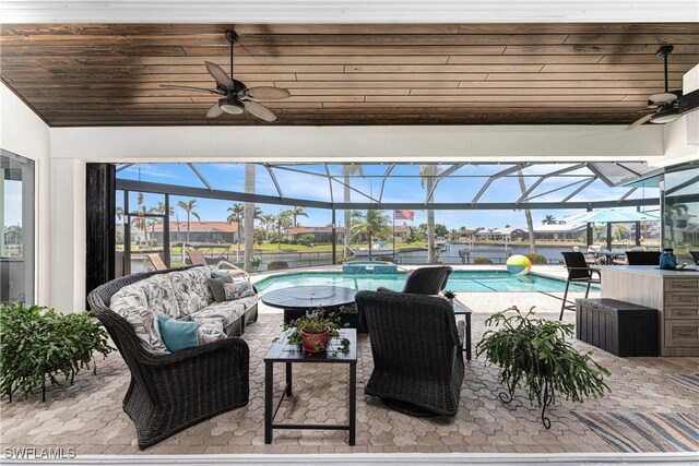 1255 Eider Ct, Punta Gorda, FL 33950 - view of patio / terrace featuring a ceiling fan, an outdoor living space, a pool with connected hot tub, and a lanai