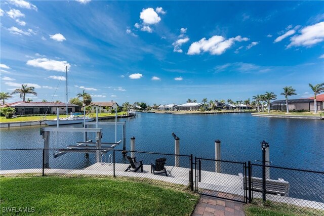 1255 Eider Ct, Punta Gorda, FL 33950 - dock area with boat lift, a water view, a gate, and a residential view