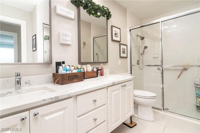 4752 Maupiti Way, Naples, FL 34119 - full bathroom featuring a shower stall, tile patterned flooring, toilet, and double vanity