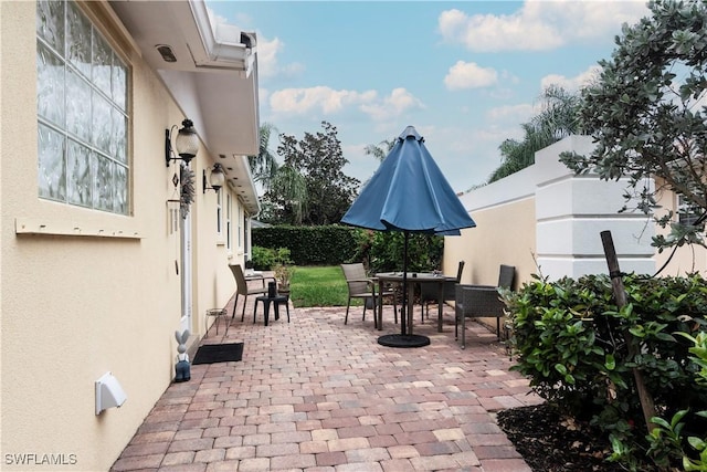 4752 Maupiti Way, Naples, FL 34119 - view of patio / terrace with outdoor dining area
