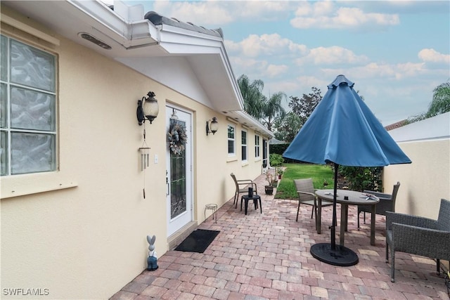 4752 Maupiti Way, Naples, FL 34119 - view of patio / terrace with outdoor dining space