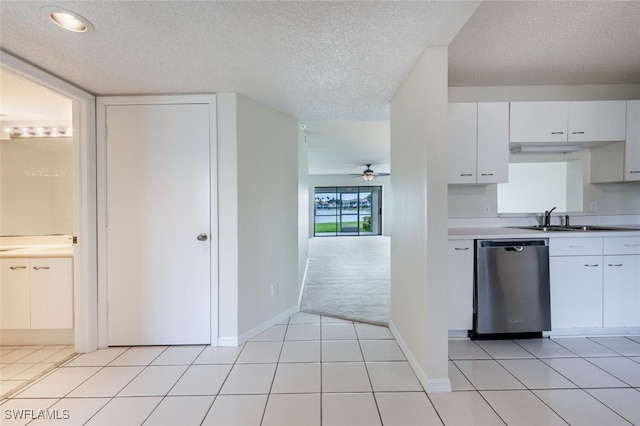 kitchen with dishwasher, a sink, a ceiling fan, light countertops, and white cabinets