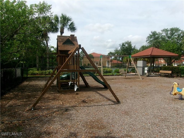 community jungle gym featuring fence and a gazebo