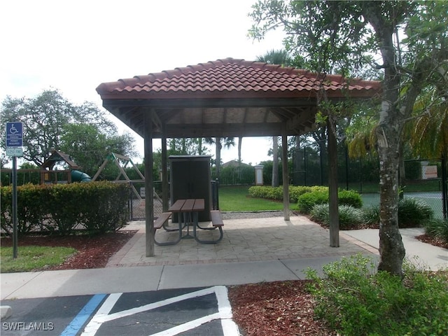 surrounding community with a gazebo and fence