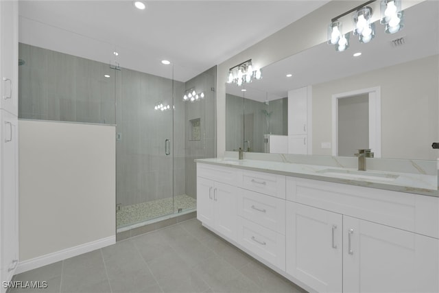 full bath featuring a sink, visible vents, recessed lighting, a stall shower, and tile patterned floors