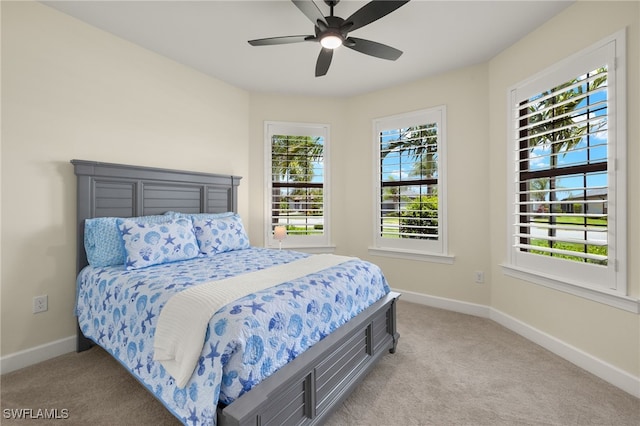 19652 Deming Ln, Estero, FL 33928 - bedroom with light colored carpet, baseboards, and a ceiling fan