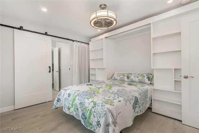 420 Donora Blvd, Fort Myers Beach, FL 33931 - bedroom featuring light wood finished floors, baseboards, recessed lighting, and a barn door