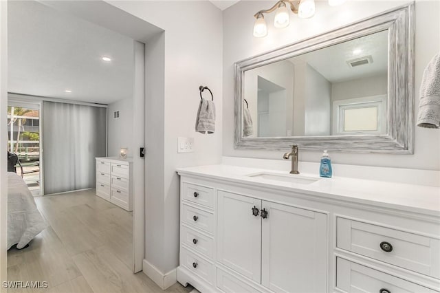 420 Donora Blvd, Fort Myers Beach, FL 33931 - bathroom with vanity, wood finished floors, and recessed lighting