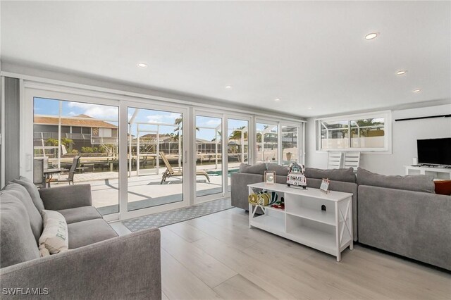 420 Donora Blvd, Fort Myers Beach, FL 33931 - living area with light wood-style flooring, healthy amount of natural light, and recessed lighting