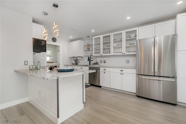 420 Donora Blvd, Fort Myers Beach, FL 33931 - kitchen featuring stainless steel appliances, light wood-type flooring, white cabinets, glass insert cabinets, and recessed lighting