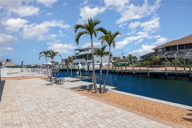 420 Donora Blvd, Fort Myers Beach, FL 33931 - view of swimming pool with a water view, a dock, and fence