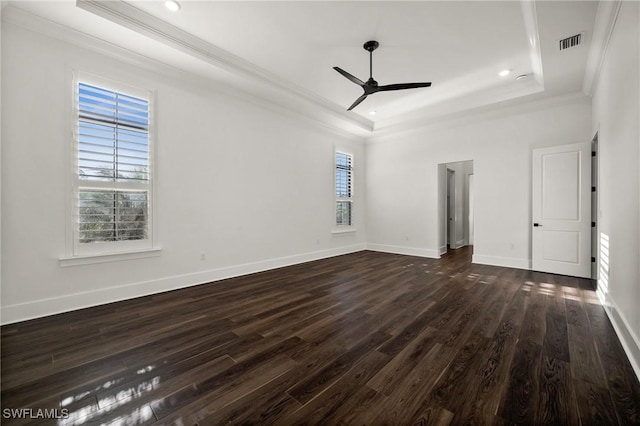 19570 Panther Island Blvd, Estero, FL 33928 - empty room featuring a tray ceiling, ornamental molding, dark wood-style floors, ceiling fan, and baseboards