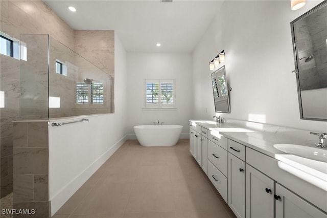 19570 Panther Island Blvd, Estero, FL 33928 - full bath featuring a walk in shower, a freestanding tub, baseboards, double vanity, and recessed lighting