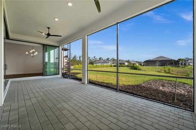 19570 Panther Island Blvd, Estero, FL 33928 - unfurnished sunroom featuring ceiling fan and a chandelier