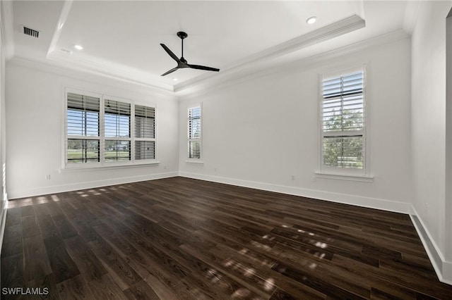 19570 Panther Island Blvd, Estero, FL 33928 - unfurnished room with a raised ceiling, ornamental molding, a ceiling fan, plenty of natural light, and dark wood-style floors