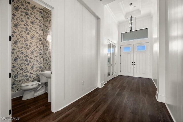 19570 Panther Island Blvd, Estero, FL 33928 - foyer featuring dark wood-style floors, baseboards, beam ceiling, and ornamental molding