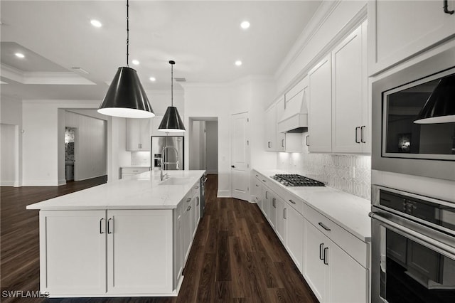 19570 Panther Island Blvd, Estero, FL 33928 - kitchen featuring stainless steel appliances, crown molding, white cabinetry, custom exhaust hood, and recessed lighting