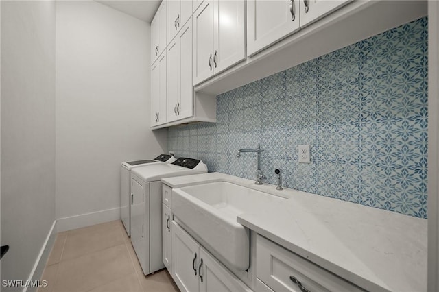19570 Panther Island Blvd, Estero, FL 33928 - laundry room with independent washer and dryer, cabinet space, baseboards, and light tile patterned floors