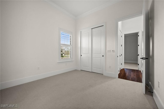 19570 Panther Island Blvd, Estero, FL 33928 - unfurnished bedroom with crown molding, carpet floors, baseboards, and a closet
