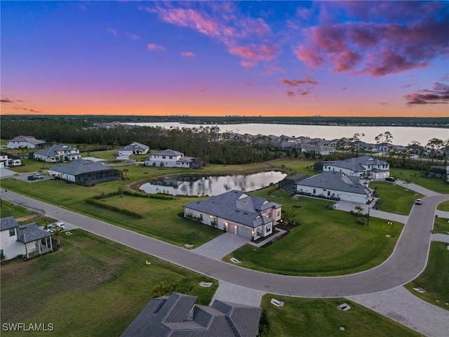 19570 Panther Island Blvd, Estero, FL 33928 - aerial view at dusk of a water view and a residential view