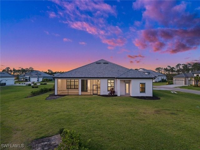 19570 Panther Island Blvd, Estero, FL 33928 - rear view of property featuring a yard and stucco siding
