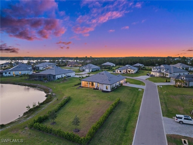 19570 Panther Island Blvd, Estero, FL 33928 - aerial view at dusk of a residential view and a water view