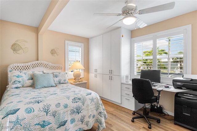 bedroom featuring light wood-type flooring and ceiling fan