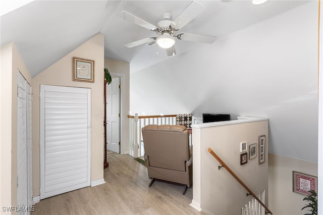additional living space featuring a ceiling fan, vaulted ceiling, and wood finished floors