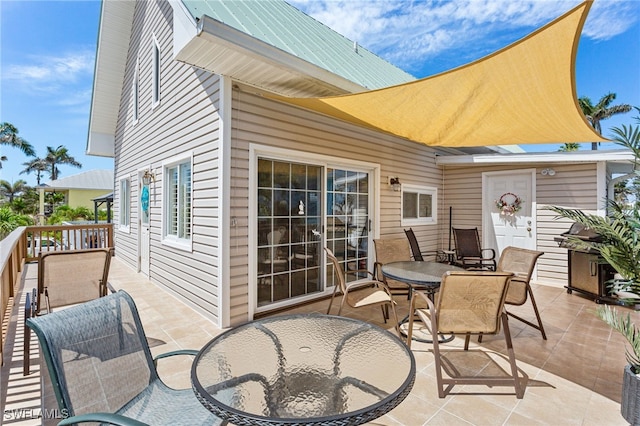 view of patio with outdoor dining area