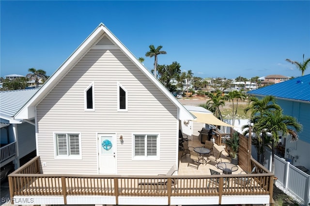 back of property with a patio