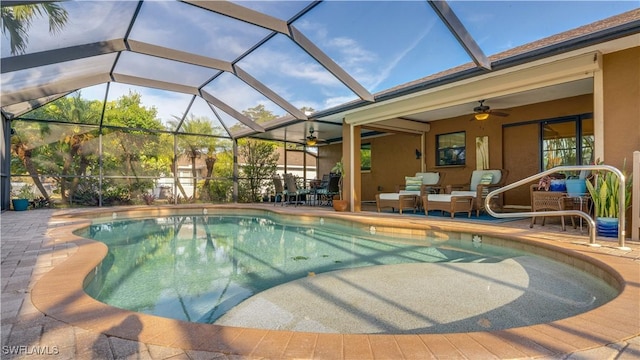 1017 SW 37th Ln, Cape Coral, FL 33914 - outdoor pool with a ceiling fan, a patio, and an outdoor living space