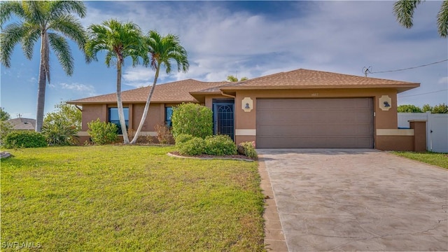1017 SW 37th Ln, Cape Coral, FL 33914 - single story home with fence, driveway, a garage, stucco siding, and a front yard