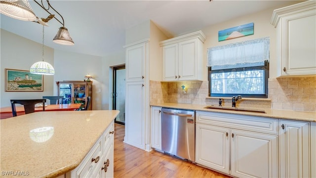 1017 SW 37th Ln, Cape Coral, FL 33914 - kitchen featuring a sink, stainless steel dishwasher, backsplash, and light wood-type flooring