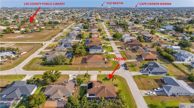 1017 SW 37th Ln, Cape Coral, FL 33914 - drone / aerial view with a residential view