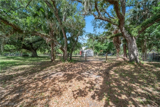 18511 Slater Rd, North Fort Myers, FL 33917 - view of yard featuring fence and an outdoor structure