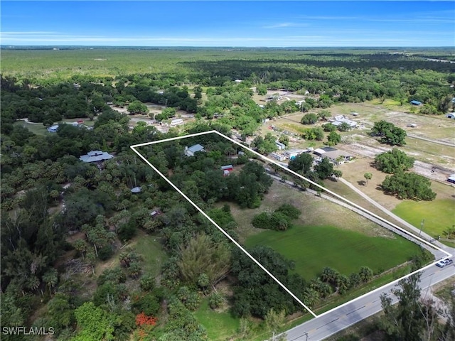 18511 Slater Rd, North Fort Myers, FL 33917 - aerial overview of property's location with a heavily wooded area and property boundaries highlighted