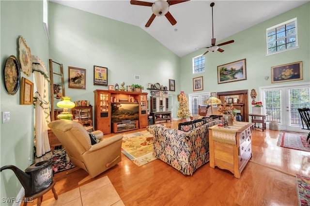 18511 Slater Rd, North Fort Myers, FL 33917 - living room featuring high vaulted ceiling, ceiling fan, and wood finished floors