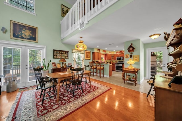 18511 Slater Rd, North Fort Myers, FL 33917 - dining area with french doors, healthy amount of natural light, light wood-style floors, and recessed lighting