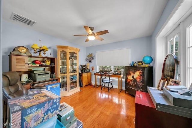 18511 Slater Rd, North Fort Myers, FL 33917 - home office featuring a ceiling fan and wood finished floors