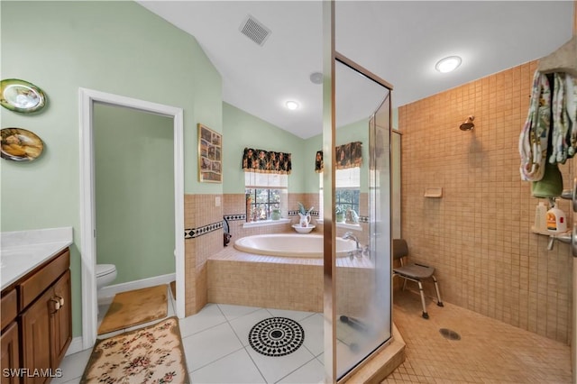 18511 Slater Rd, North Fort Myers, FL 33917 - bathroom with tiled shower, lofted ceiling, tile patterned floors, a garden tub, and toilet