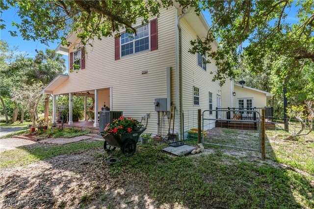 18511 Slater Rd, North Fort Myers, FL 33917 - view of side of home featuring a patio