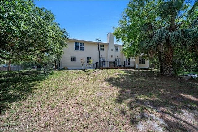 18511 Slater Rd, North Fort Myers, FL 33917 - back of house featuring a chimney